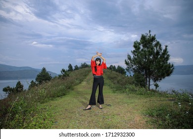 Beautiful Women Pose On The Mount Holbung Lake Toba