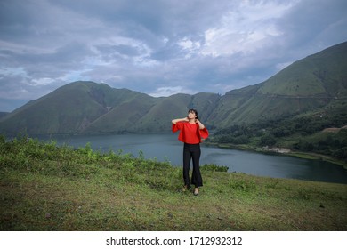 Beautiful Women Pose On The Mount Holbung Lake Toba