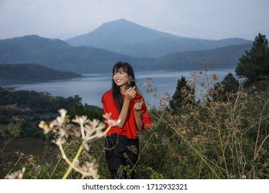 Beautiful Women Pose On The Mount Holbung Lake Toba