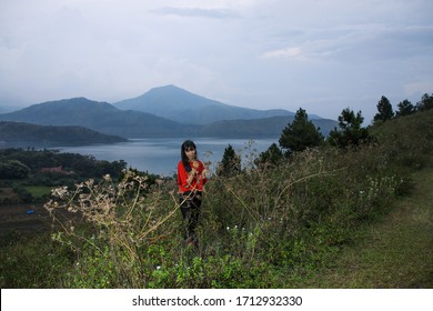 Beautiful Women Pose On The Mount Holbung Lake Toba