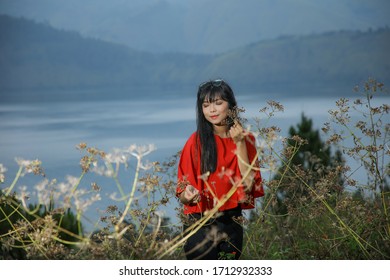 Beautiful Women Pose On The Mount Holbung Lake Toba