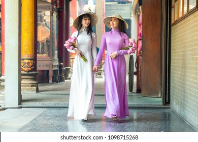 Beautiful women with Vietnam culture traditional dress, Ao dai is famous traditional costume , Ho Chi minh Vietnam.