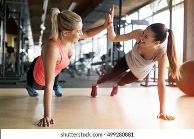 Beautiful women working out in gym together - Shutterstock ID 499280881