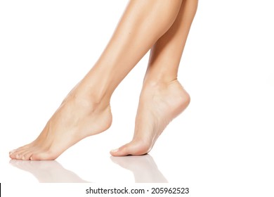 Beautiful Women's Feet On White Background