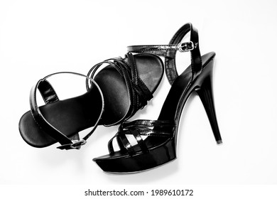 Beautiful Womens Shiny Patent Black Stiletto Sandals On A White Background 
