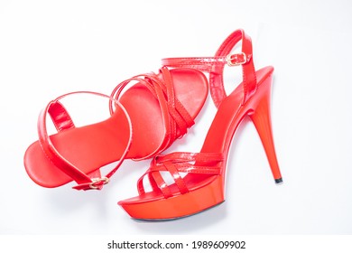 Beautiful Womens Shiny Patent Red Stiletto Sandals On A White Background 
