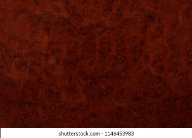 A beautiful wood grain effect with natural burl.  Use as a tileable backdrop.