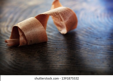 Beautiful wood shavings, on an old workbench. Shallow depth of field.