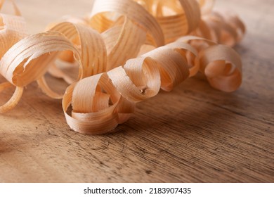 Beautiful Wood Shavings, On A Old Work Desk. Shallow Depth Of Field.