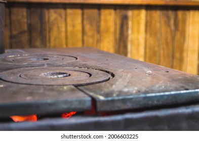 Beautiful wood-burning iron stove in a rustic cabin - Powered by Shutterstock