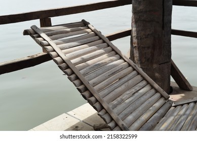 Beautiful Wooden Chair With Sun Over Riverbank