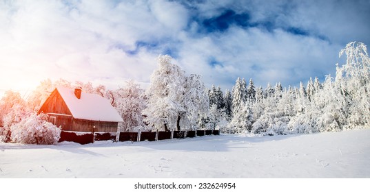 Beautiful Wooden House In A Winter Sunny Day