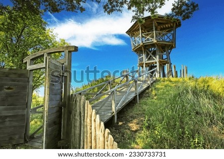 Beautiful wooden look-out tower with picnic spot on hill in rural dutch landscape along hiking and cycle trail - Heeskijk near Heeswijk, Noord-Brabant, Netherlands Stock photo © 