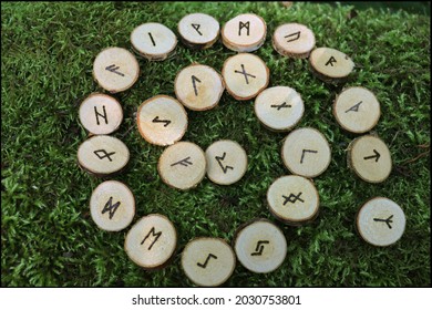 Beautiful Wooden Nordic Runes Set With Mossy Background