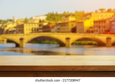 Beautiful Wooden Table On The Background Of Italian Florence During Sunset. Copy Space. Product Demo Template Concept