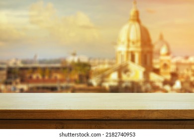 Beautiful Wooden Table On The Background Of Italian Roman During Sunset. Copy Space. Product Demo Template Concept
