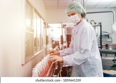 Beautiful worker working in hygiene and clean drink factory in european country. - Powered by Shutterstock