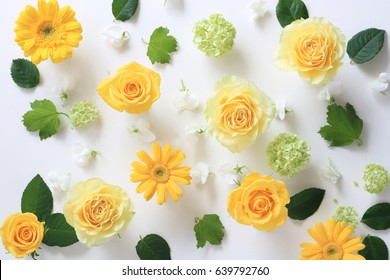 Beautiful yellow roses, snow balls and gerber flowers on white background.flat lay top view. 
