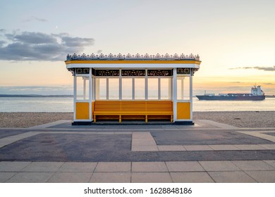 Beautiful Yellow Vintage Bus Stop By The Sea In Portsmouth, UK