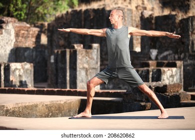 Beautiful yoga position at the ruins of India.