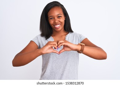 Beautiful young african american woman wearing casual t-shirt over isolated background smiling in love showing heart symbol and shape with hands. Romantic concept. - Shutterstock ID 1538312870