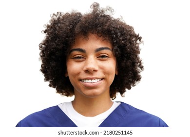 Beautiful Young African American Woman With A Natural, Loose, Curly Afro, Wearing A White Shirt And Navy Blue Scrubs Looking Forward, Smiling                               