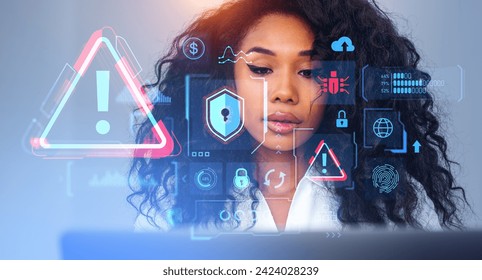 Beautiful young African American woman using laptop with immersive cybersecurity interface. Concept of data protection - Powered by Shutterstock