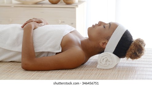 Beautiful Young African American Woman Relaxing In Spa Salon