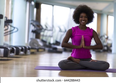 Beautiful Young African American Woman Exercise Yoga In Gym