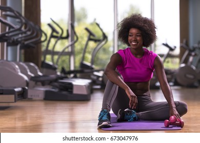 Beautiful Young African American Woman Exercise Yoga In Gym