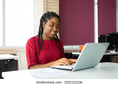 Beautiful Young African Woman In Office With Laptop