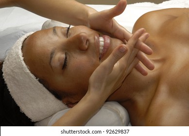 Beautiful Young Afro American Woman Getting A Face Treatment At Beauty Salon. Beautiful Young Black Woman Getting A Face Treatment At Beauty Salon.