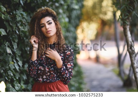 Similar – Beautiful young arabic woman with black curly hairstyle