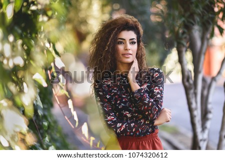 Similar – Beautiful young arabic woman with black curly hairstyle