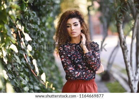 Similar – Beautiful young arabic woman with black curly hairstyle