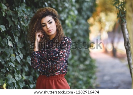 Similar – Beautiful young arabic woman with black curly hairstyle