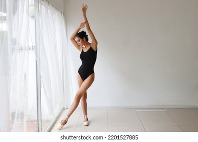 Beautiful Young Asian Ballet Dancer On White Wall Studio