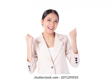 Beautiful Young Asian Business Woman Wearing Suit Feeling Successful, Good Job, Happy And Smile Celebrating With Arms Up Isolated On White Background.