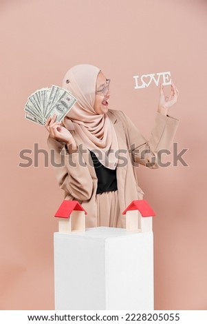 Beautiful young asian hijab muslim business woman confident and smiling, isolated  background