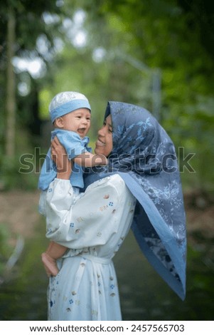 Beautiful young Asian mother bonding with Muslim son Health care and medical love asian woman lifestyle mother's day