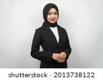 Beautiful young asian muslim business woman confident and smiling, isolated on gray background