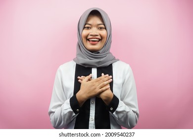 Beautiful Young Asian Muslim Woman Smiling Surprised And Cheerful, With Hands Holding Chest, Excited, Not Expecting, Looking At Camera Isolated On Pink Background