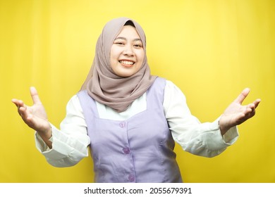 Beautiful Young Asian Muslim Woman Smiling Cheerfully, With Open Arms To Camera, Welcome Sign Hand, Hand Sign Wanting To Hug, Isolated On Yellow Background