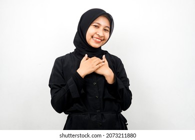 Beautiful Young Asian Muslim Woman Smiling Surprised And Cheerful, With Hands Holding Chest, Excited, Not Expecting, Looking At Camera Isolated On White Background