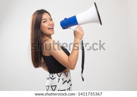 Beautiful young Asian woman announce with megaphone on white background