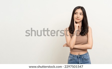 Beautiful young asian woman in brown shirt. Charming female lady standing pose thinking on isolated white blank background. Asian cute people looking copy space for text advertise
