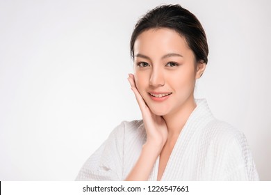 Beautiful Young asian Woman with Clean Fresh Skin look. Girl beauty face care. Facial treatment. Cosmetology, beauty and spa.