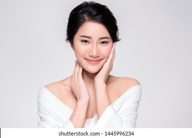 Beautiful Young Asian Woman With Clean Fresh Skin Touch Own Face, Facial Treatment, Cosmetology, Beauty And Spa,