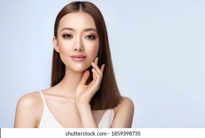 Beautiful Young Asian Woman With Clean Fresh Skin On Face . Chinese Girl Facial  Treatment . Cosmetology , Beauty  And Spa .