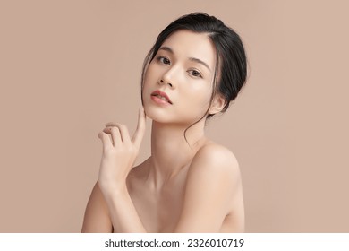 Beautiful young asian woman with clean fresh skin on beige background, Face care, Facial treatment, Cosmetology, beauty and spa, Asian women portrait. - Shutterstock ID 2326010719